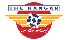 Logo for “The Hangar on the Wharf” with a blue airplane propeller over a red and orange sunburst.