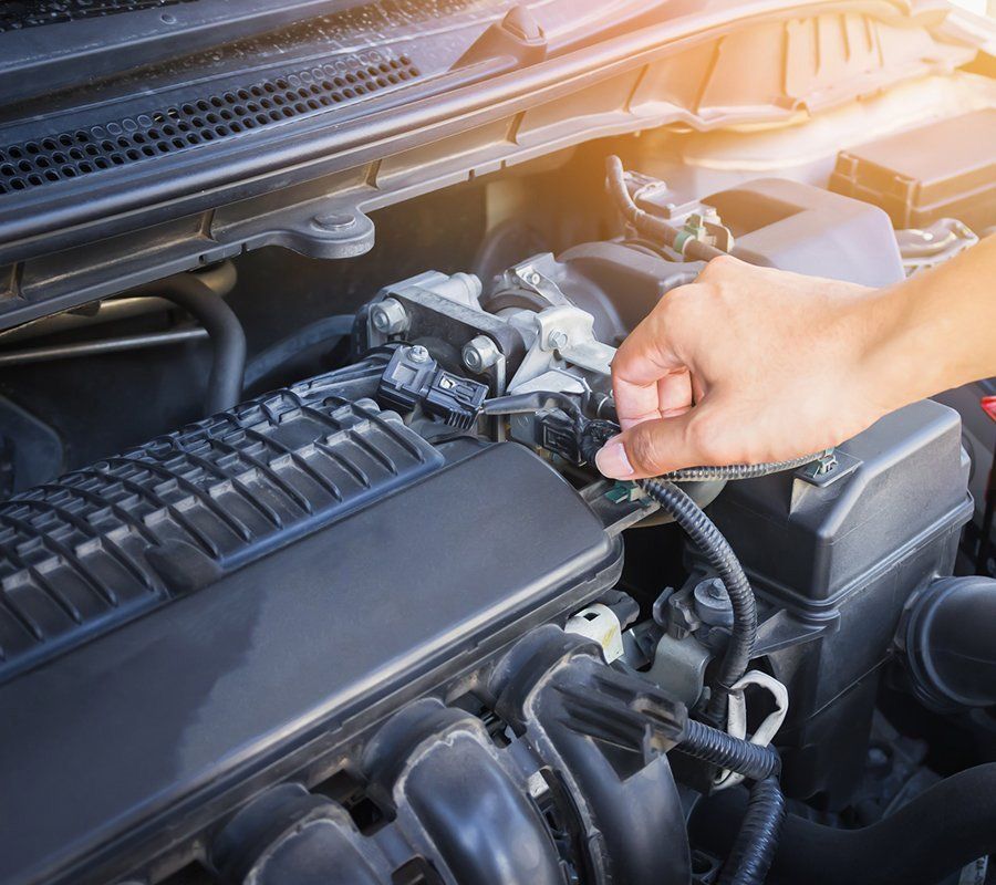 Person Checking Engine Status — Hermiston, OR — Pioneer Transmission Service Inc