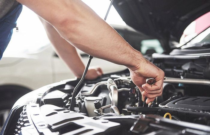 Auto Mechanic Repairing Car Engine — Hermiston, OR — Pioneer Transmission Service Inc