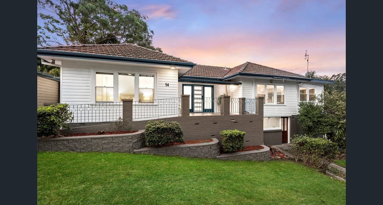 A White House with A Large Lawn in Front of It — Maison Property Management in New Lambton Heights, NSW