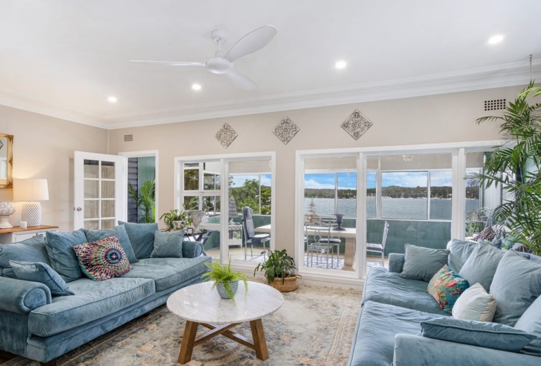 A Living Room Filled with Furniture and a Ceiling Fan.