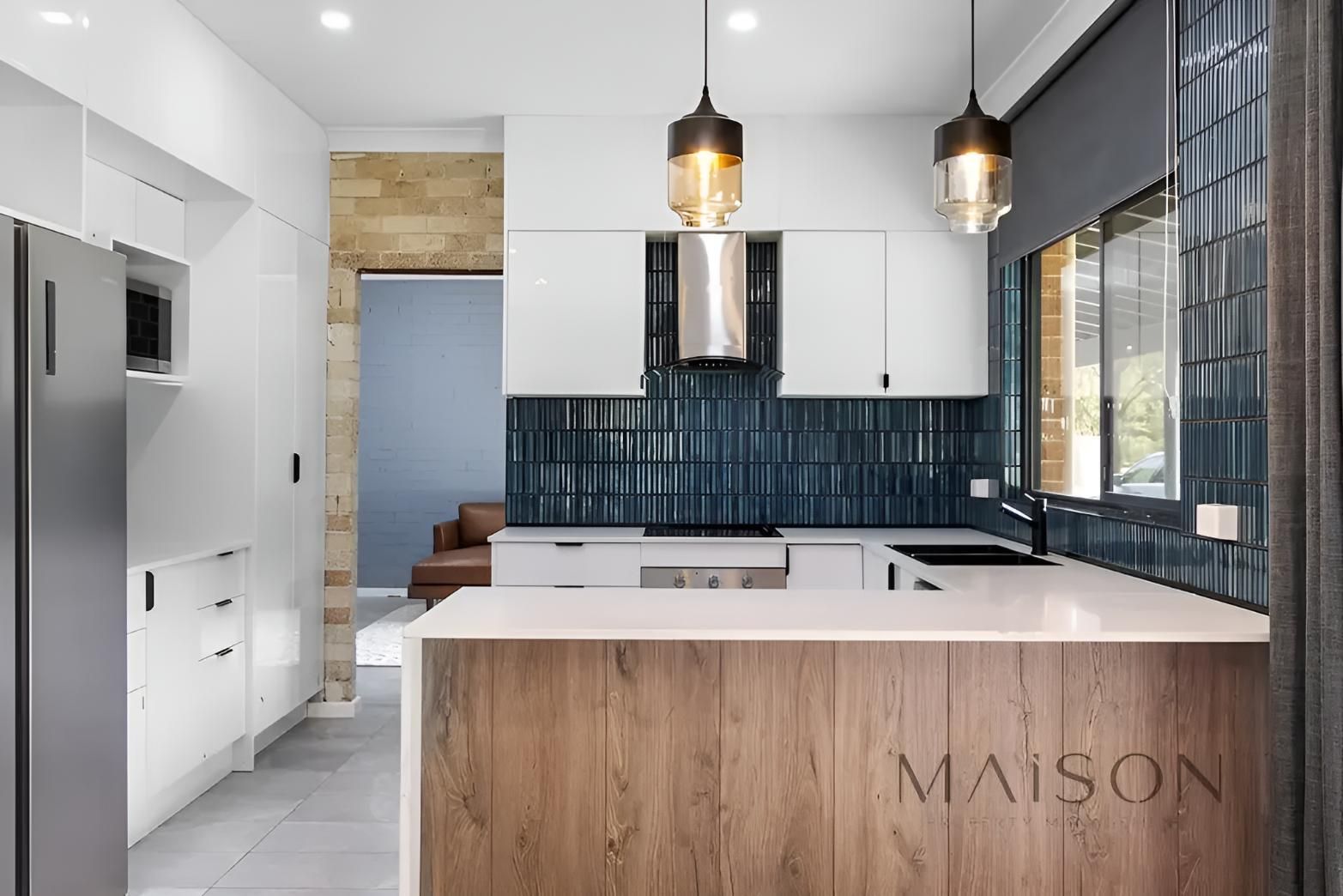 Kitchen With White Cabinets — Maison Property Management in Salt Ash, NSW