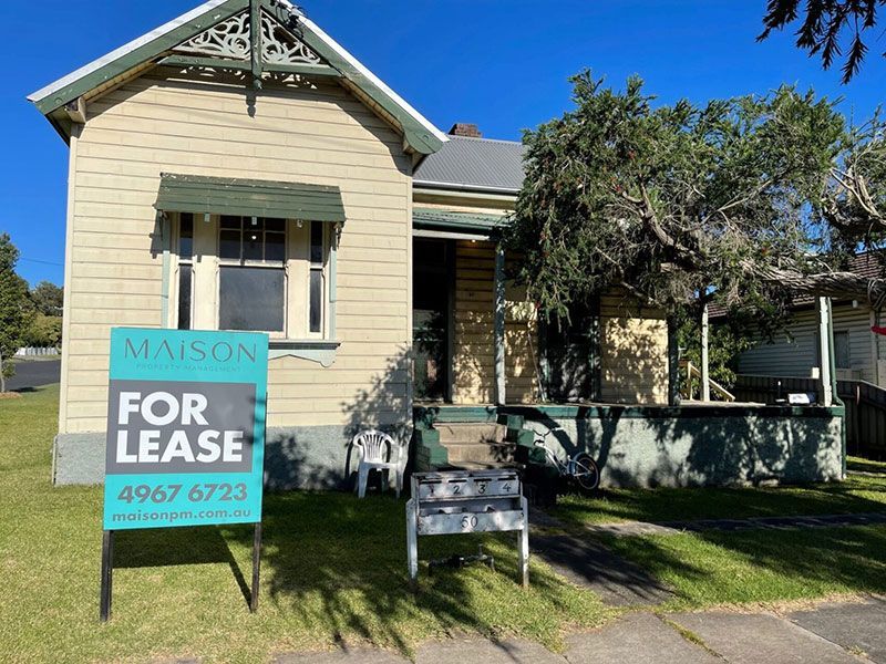 A House with A for Lease Sign in Front of It — Maison Property Management in Mayfield, NSW