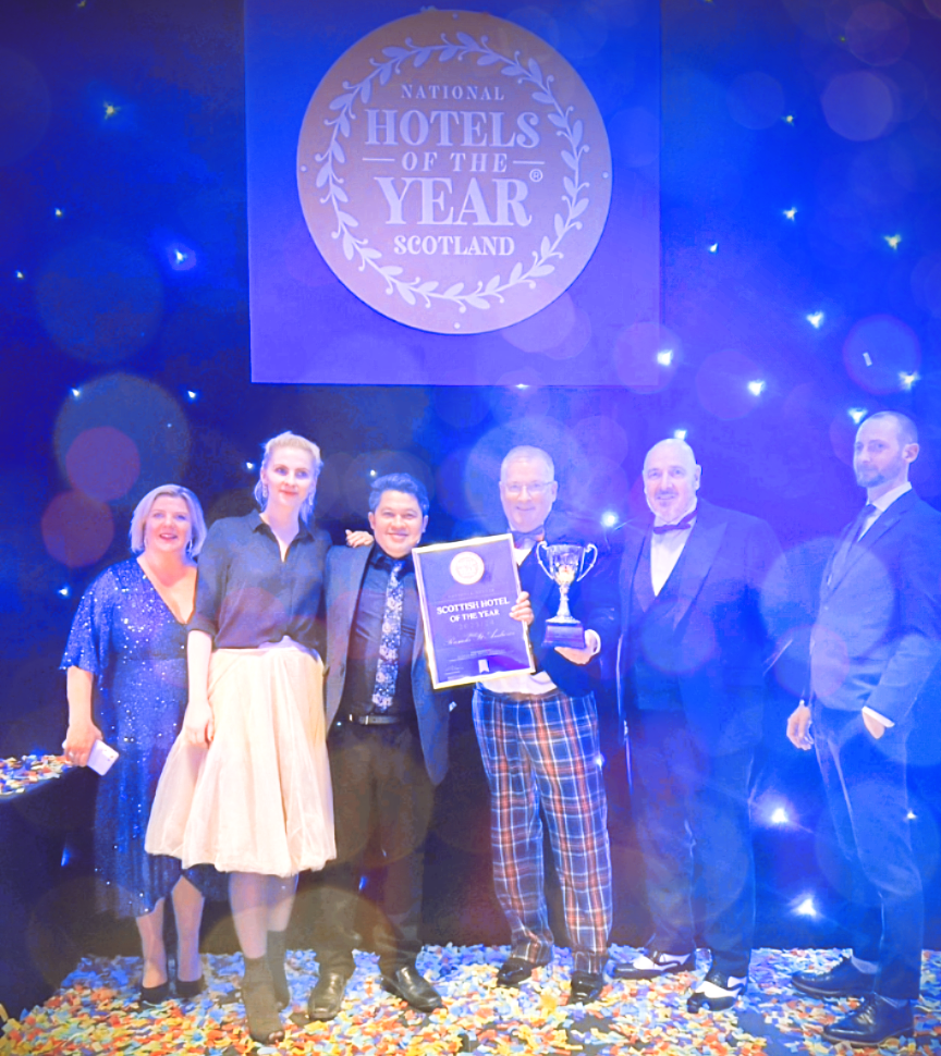 Seamus Coen, General Manager, and Team of Rusacks St Andrews Hotel with the 2023/24 National Hotel of the Year Scotland Silver Cup