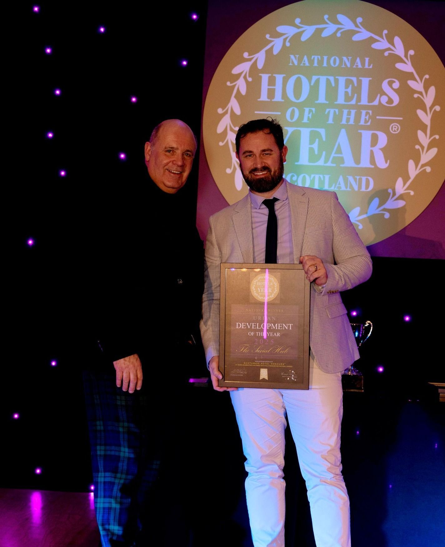 Ben McLeod of The Social Hub, Glasgow receives the Urban Development of the Year 2025 award from Marc Crothall, CEO of the Scottish Tourism Alliance