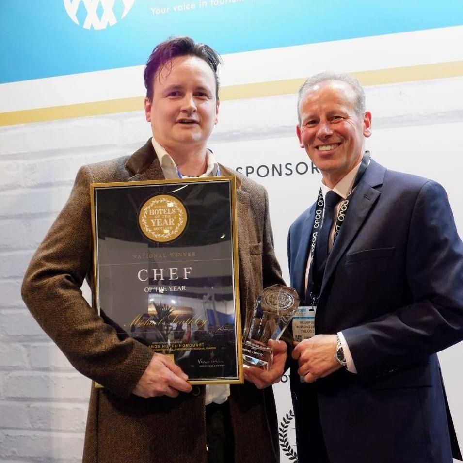 Michael Leathley, Head Chef at The Pierhouse Hotel, Argyll receives the Chef of the Year trophy from HOTYS President William Gorol at ScotHot