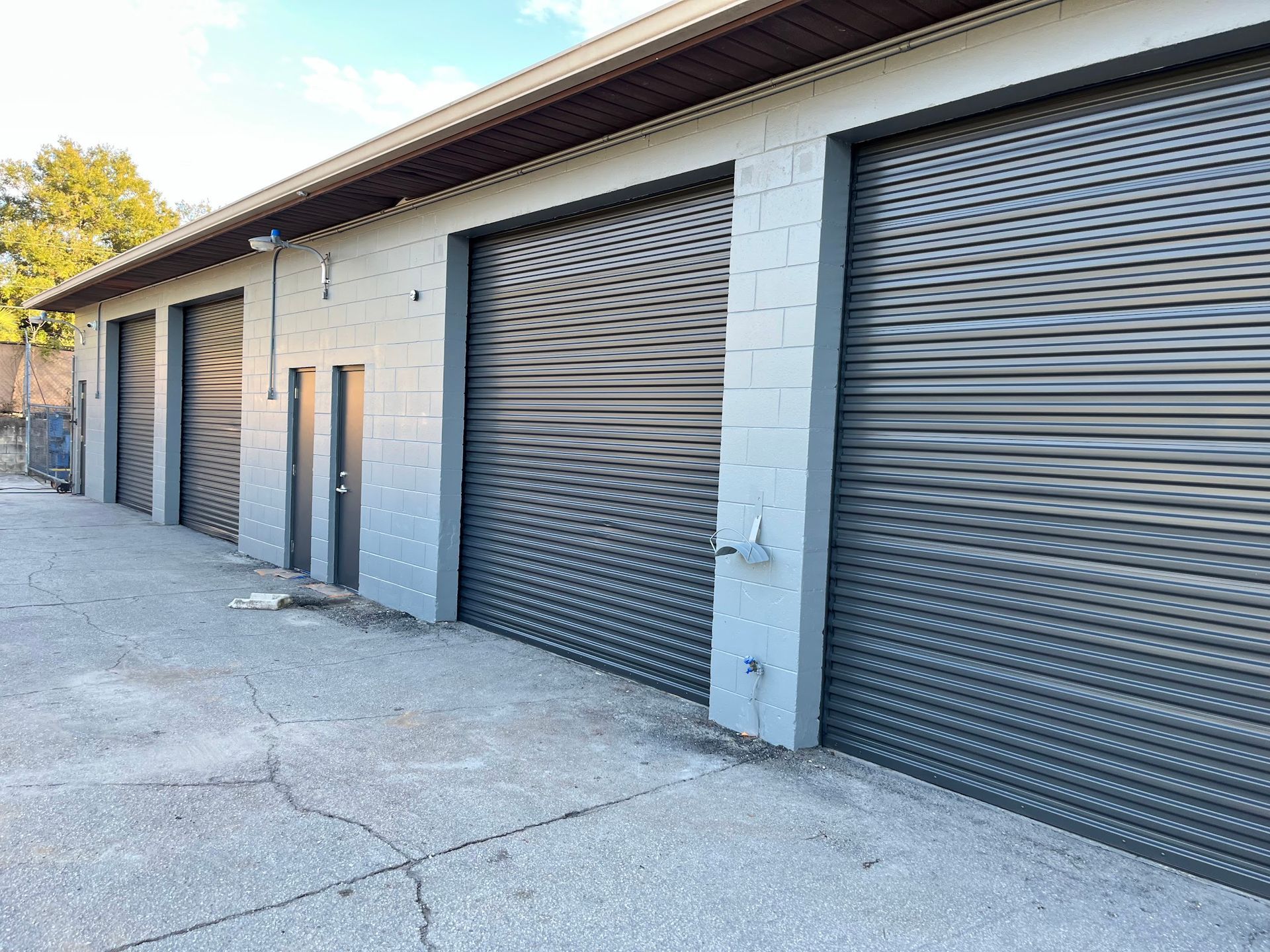 A row of garage doors on the side of a building.