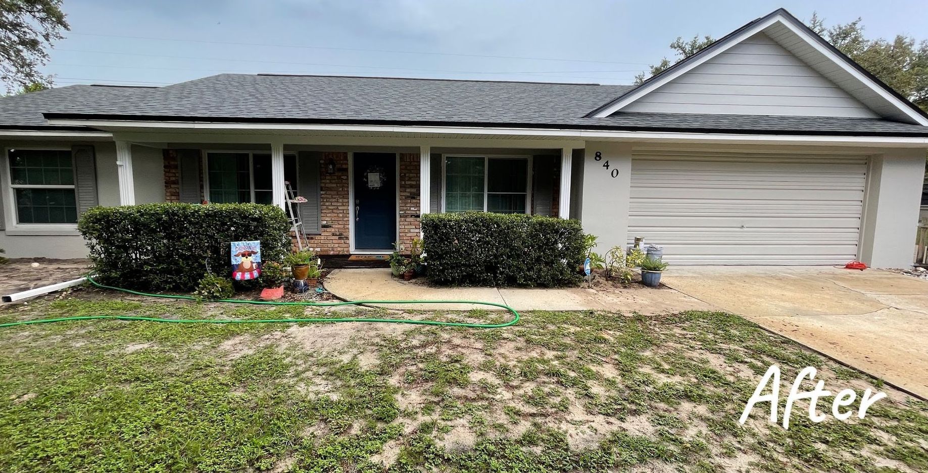 A picture of a house after being painted white.