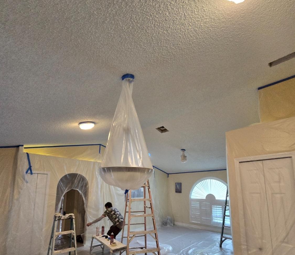 An empty room with drywall walls and a door.