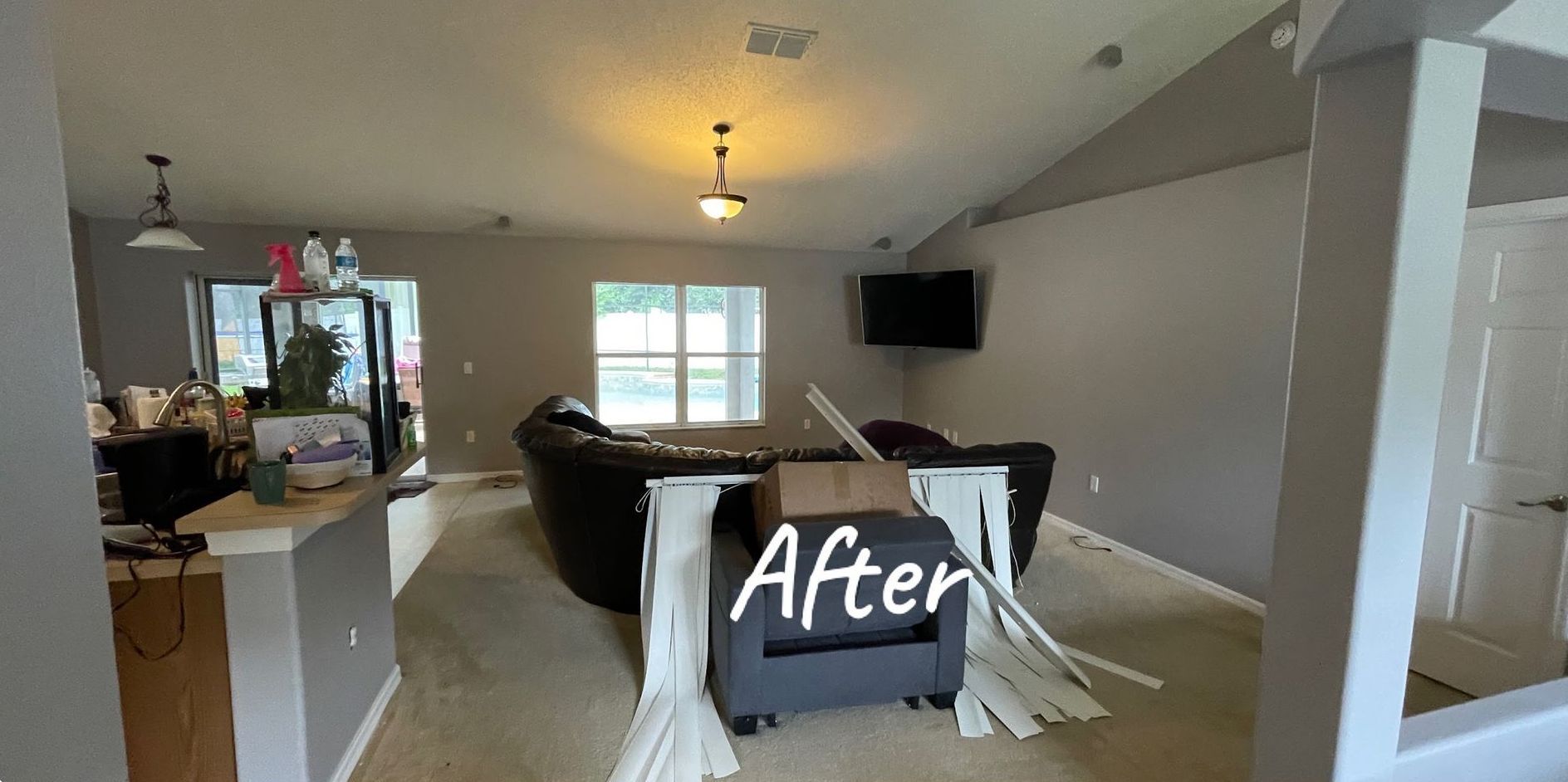 A living room with a couch and chair and a sign that says `` after ''.