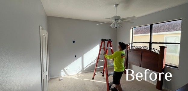 A large house with a brick archway in front of it