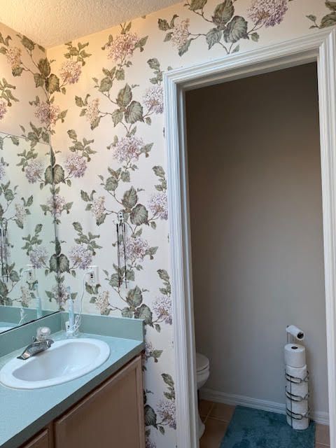 A picture of a house after being painted white.