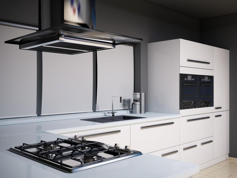 a kitchen with built in appliances