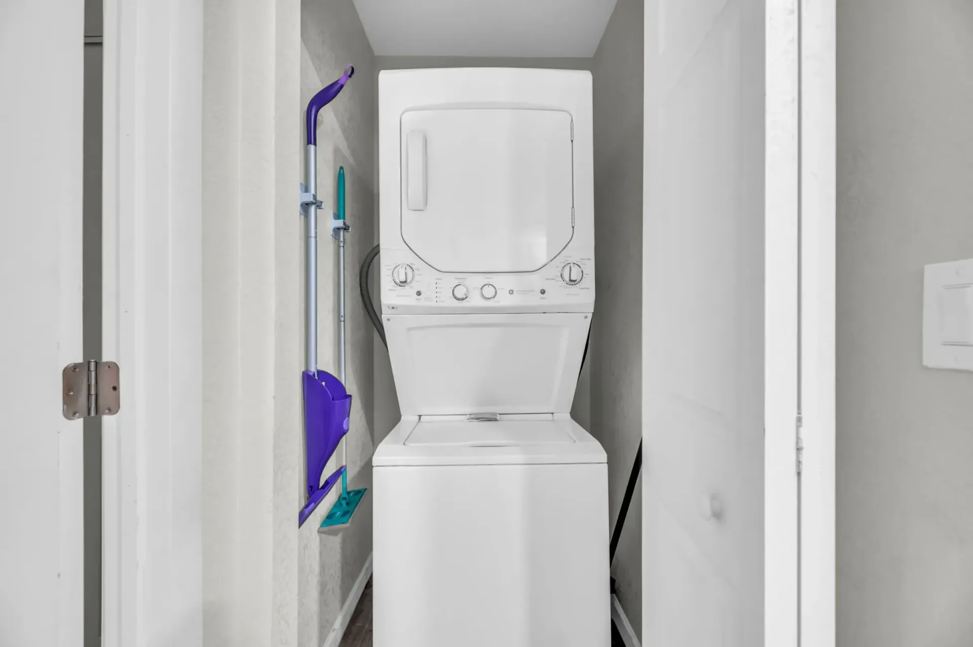 a white washer and dryer stacked on top of each other