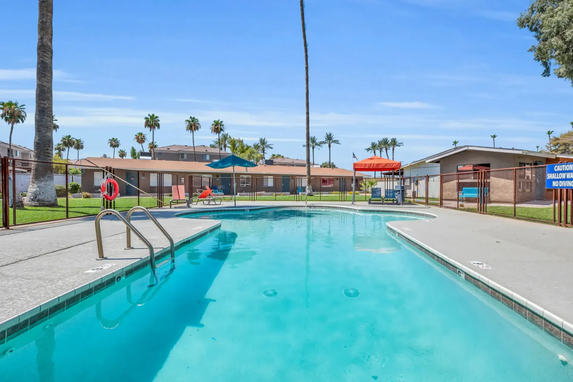 a swimming pool with a sign that says no diving