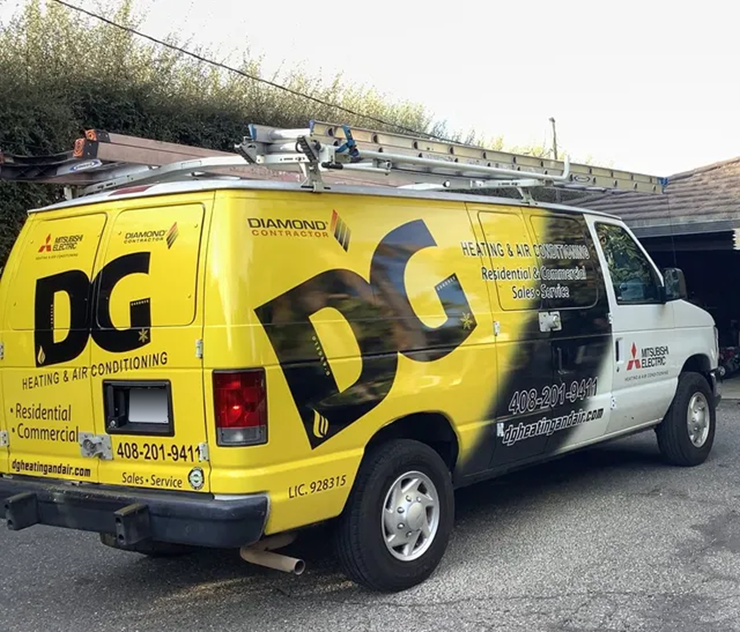 Woman holding baby, smiling, near staircase. Child watches from behind a table.