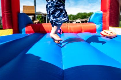 kid jumping in the inflatable