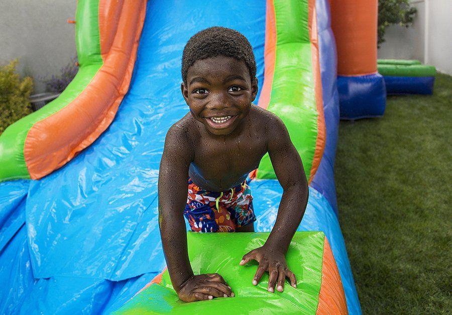 kid playing in the slide