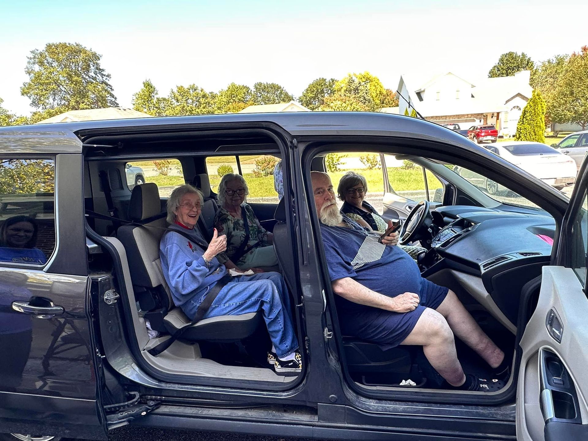 elderly residents in car for shuttle service | ozark mo memory care
