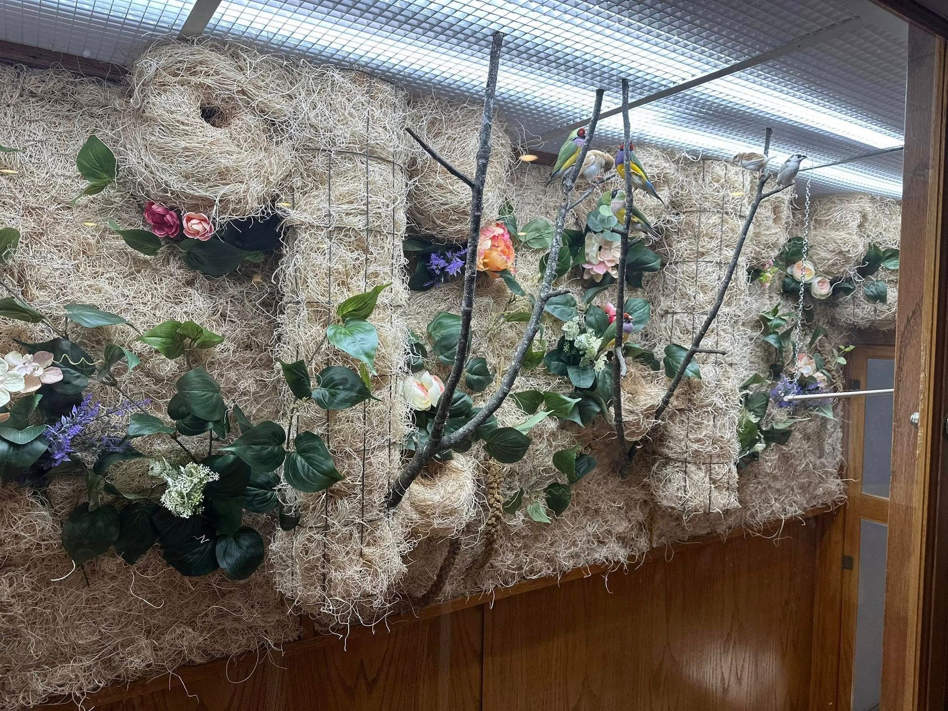 A bunch of hay bales with flowers and leaves on them