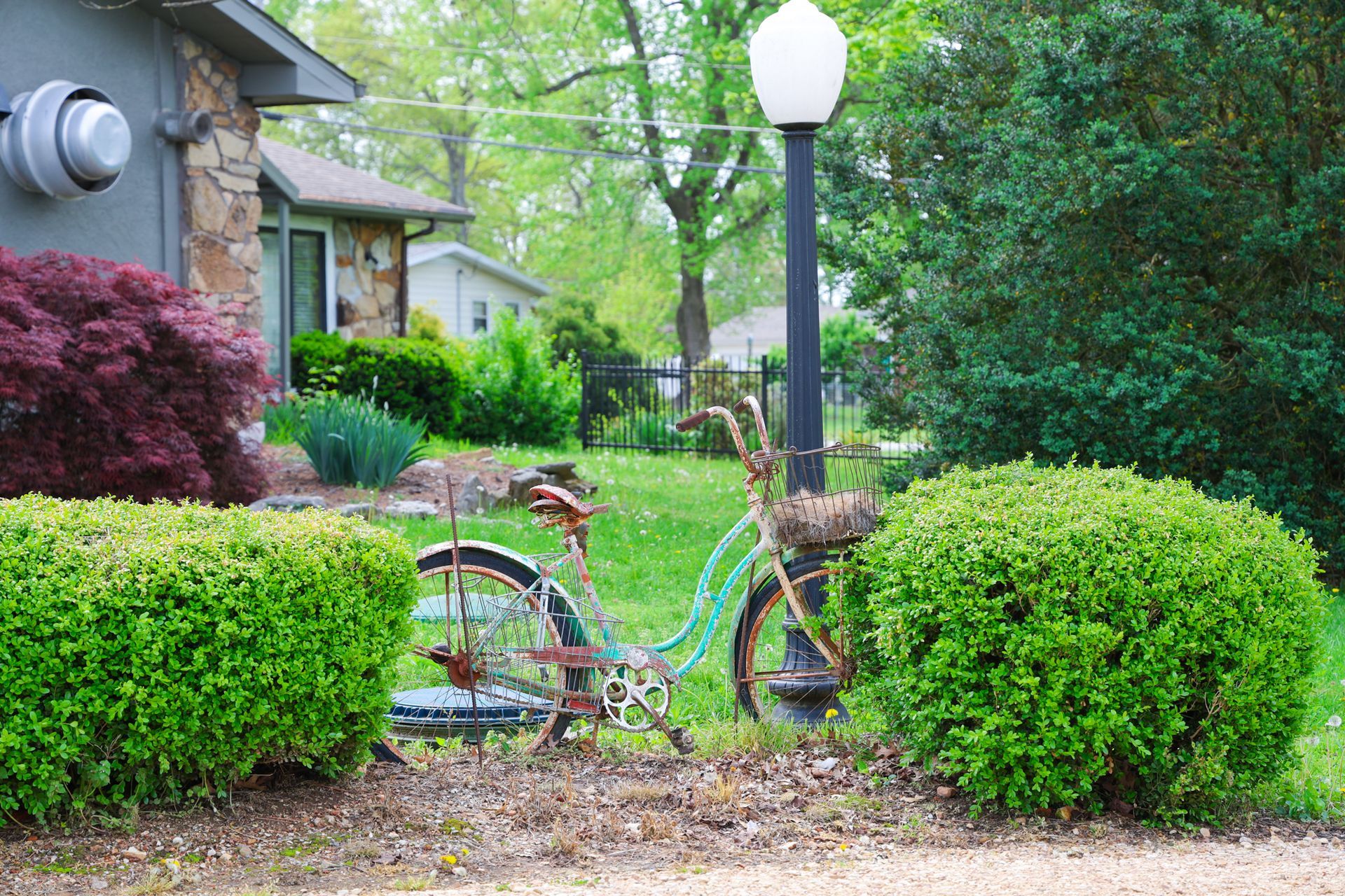 A bicycle is parked in front of a house