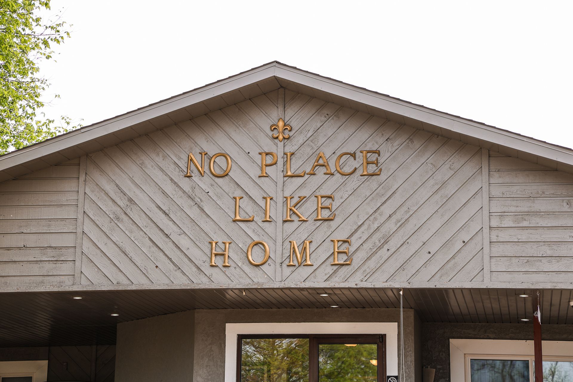 A building with a sign that says no place like home