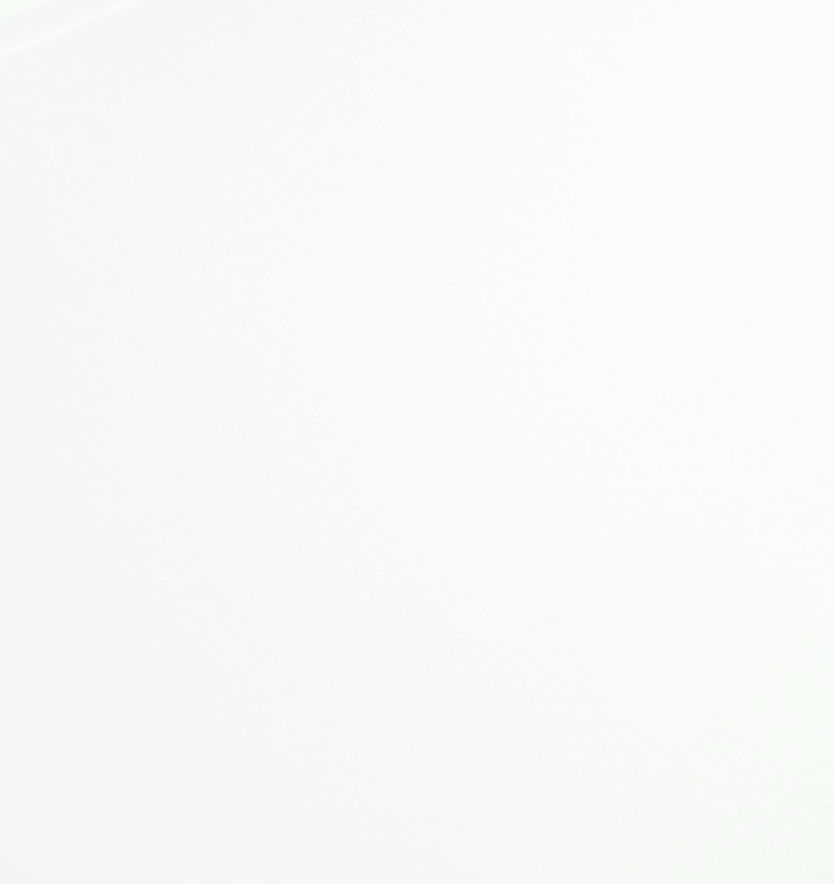 A close up of a white background with a plain texture.