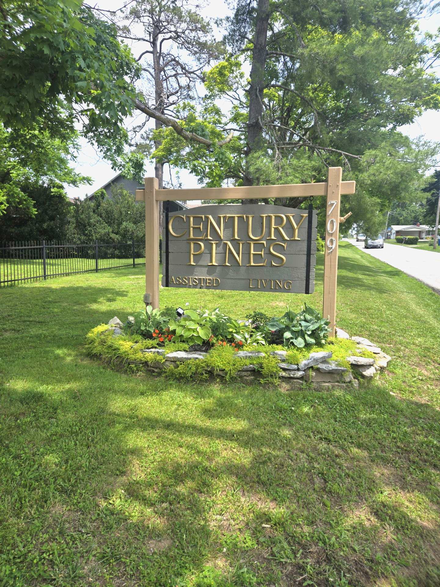 A wooden sign that says century pines on it | Top assisted living apartments near Springfield and Nixa MO
