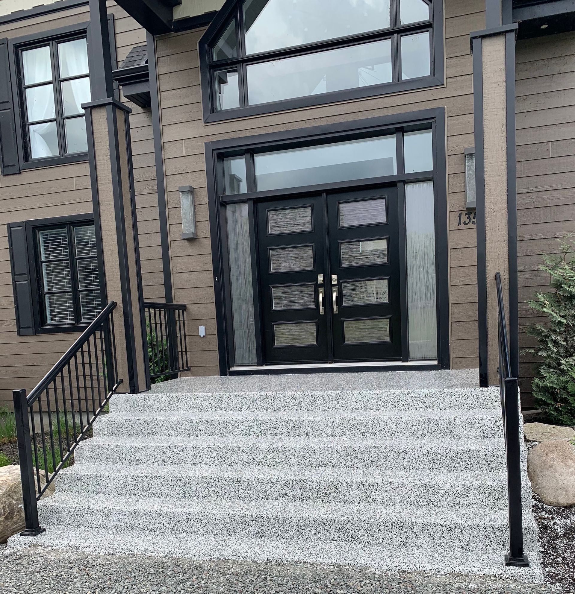 A house with stairs leading up to the front door