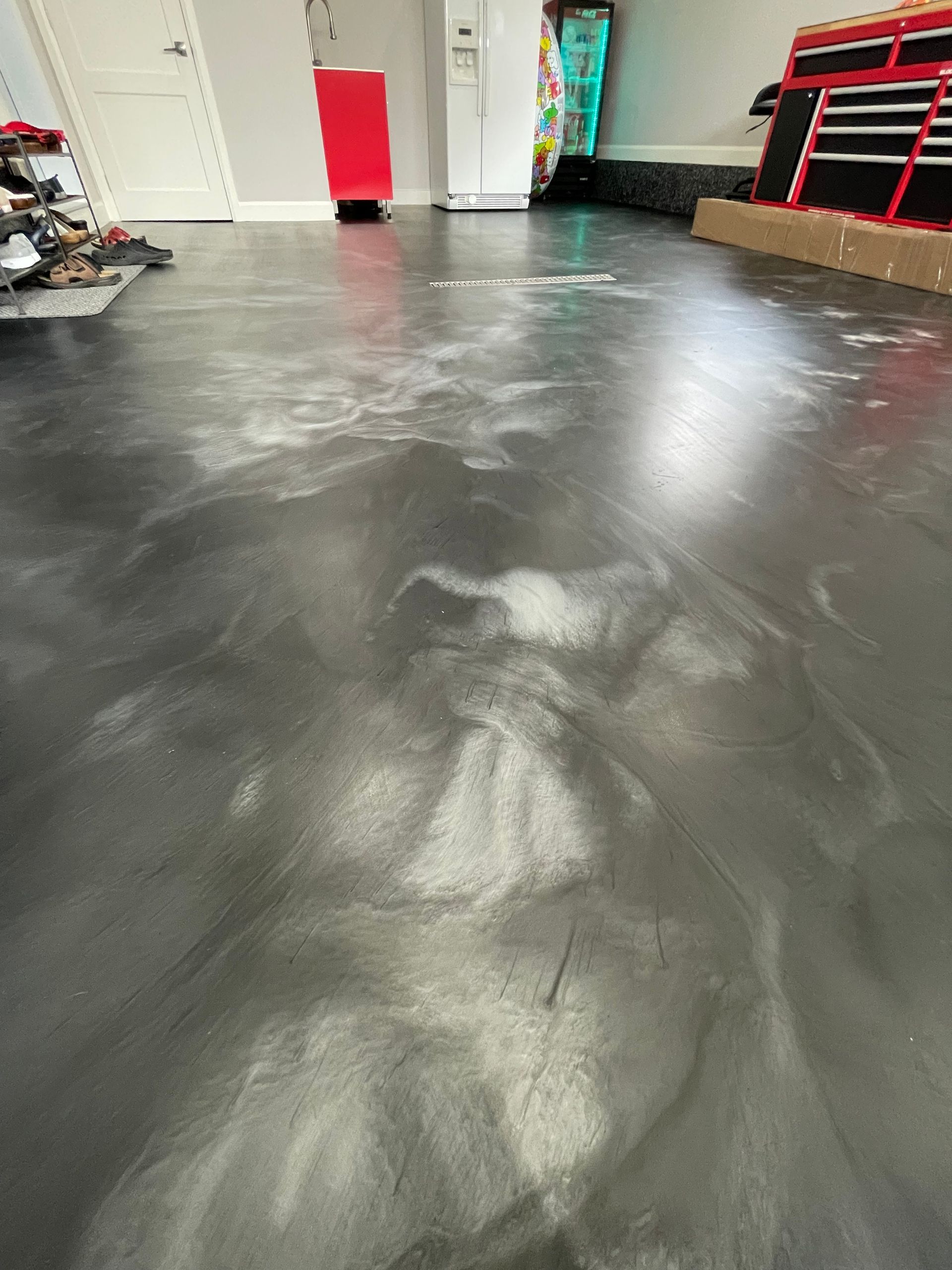 A close up of a concrete floor in a garage.