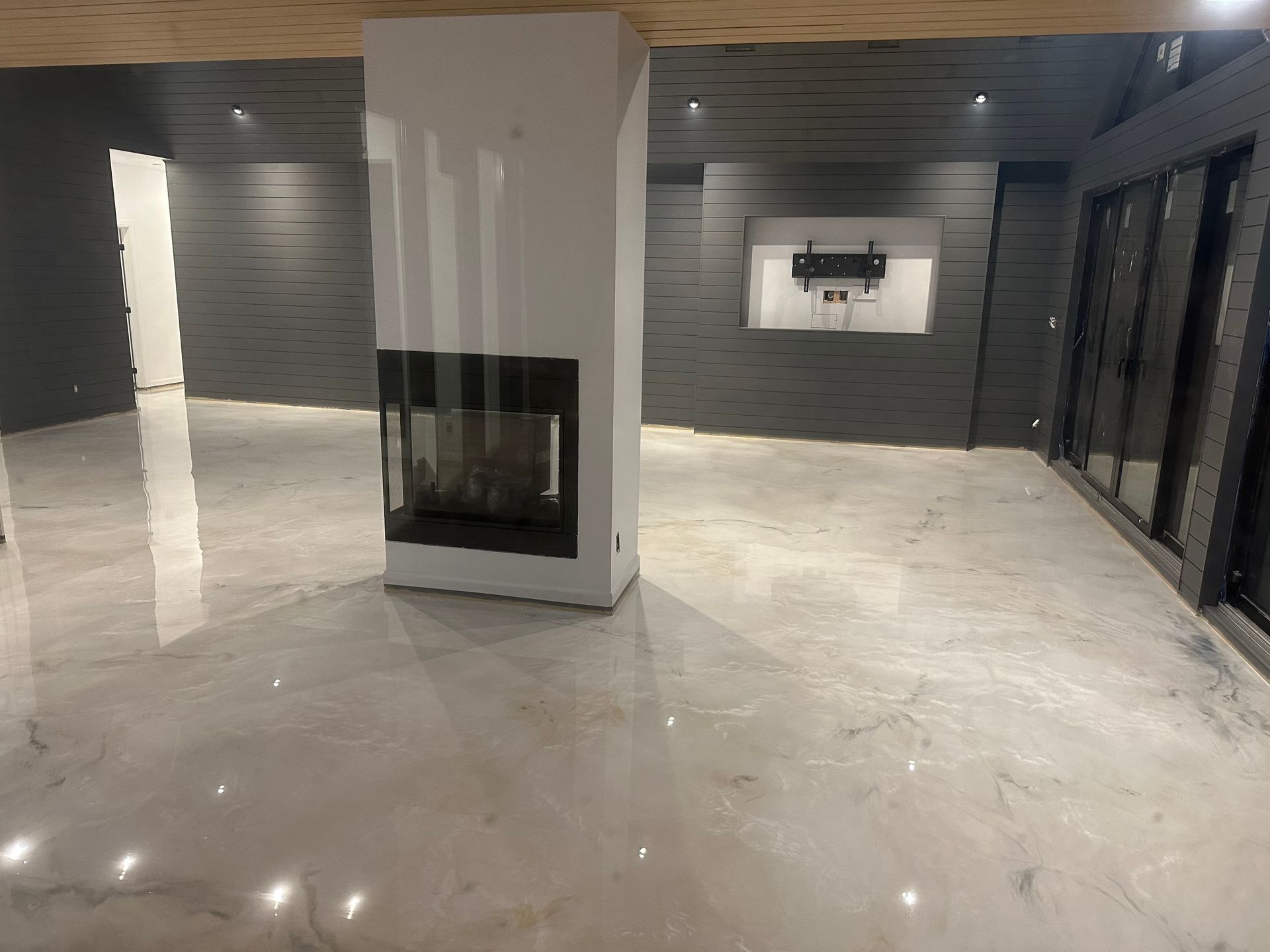 There is a fireplace in the middle of the room.