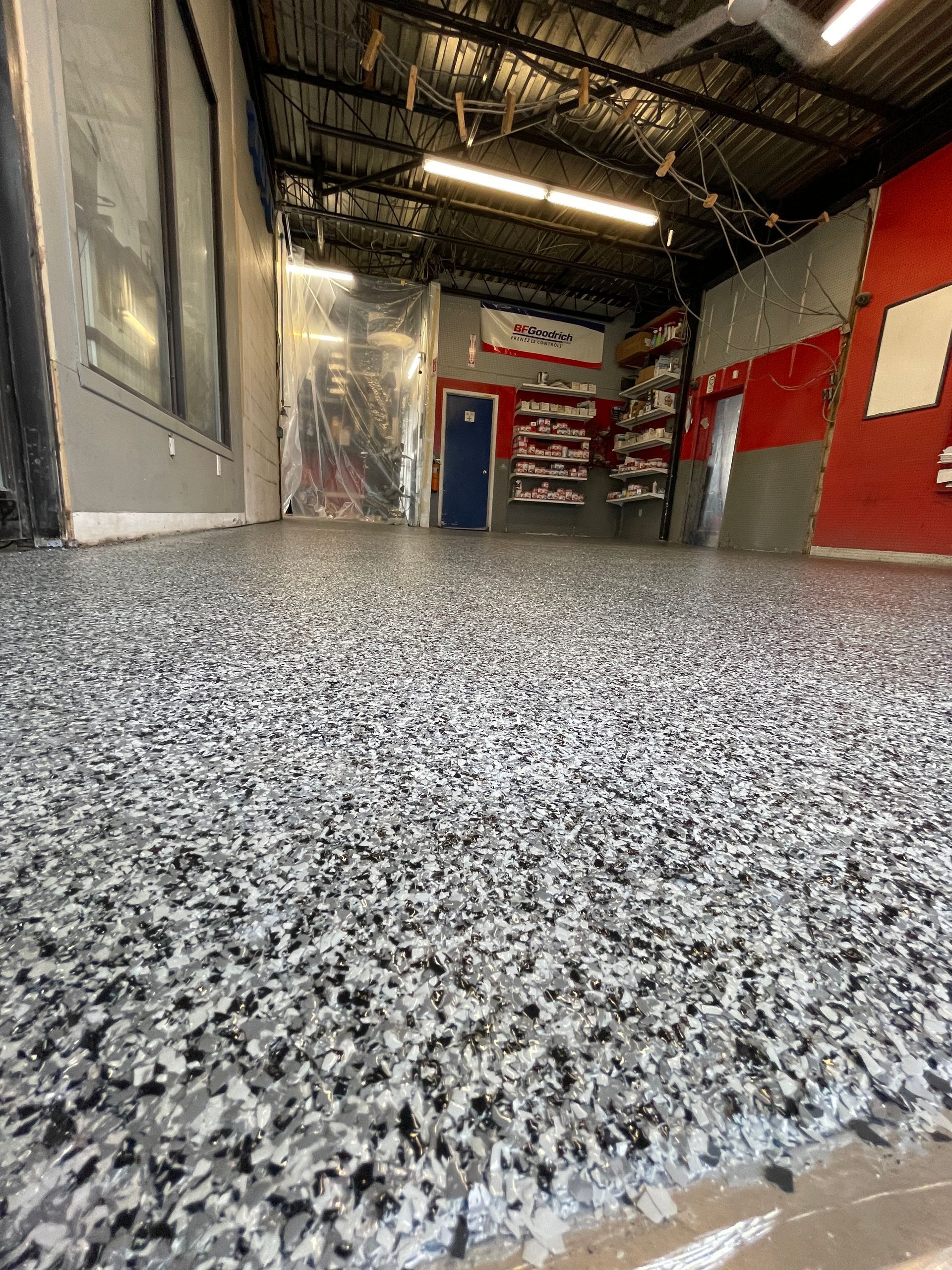 A garage floor with a lot of small rocks on it.