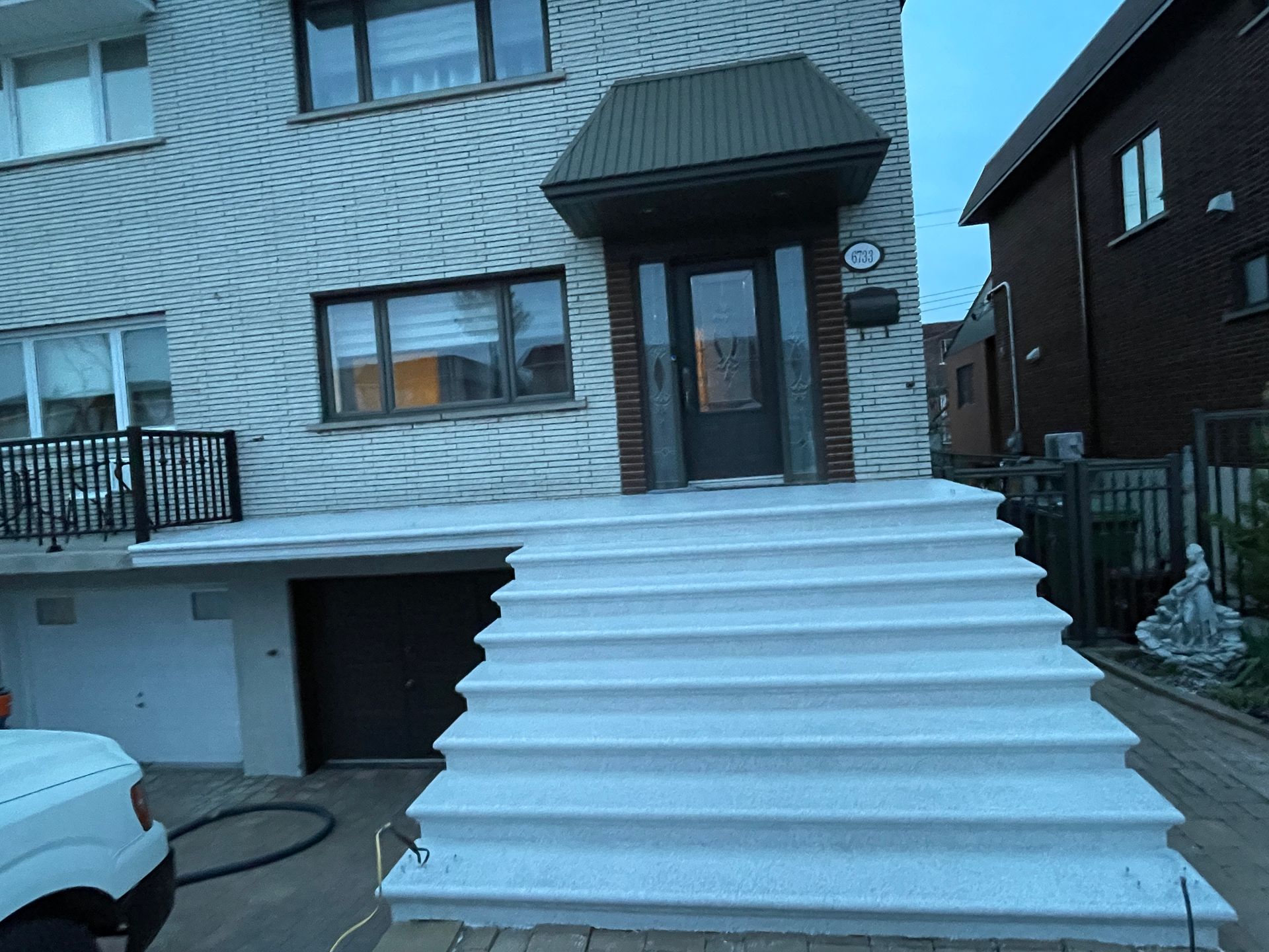 A house with stairs leading up to the front door