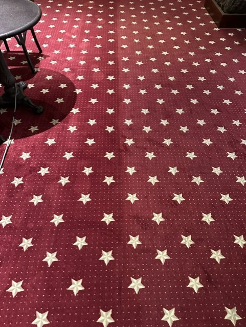 A red carpet with white stars on it
