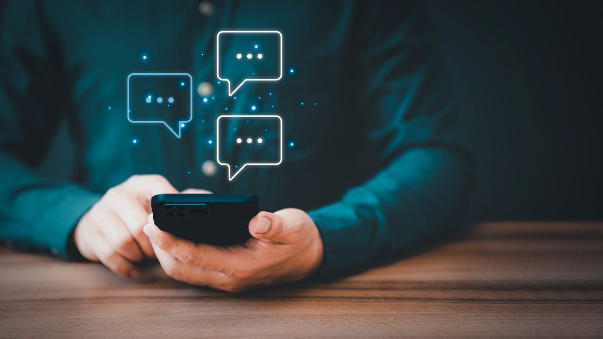 Man using smartphone typing live chat