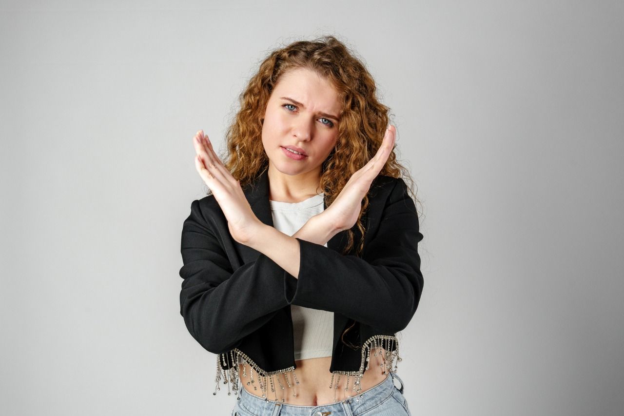 woman standing with her arms crossed