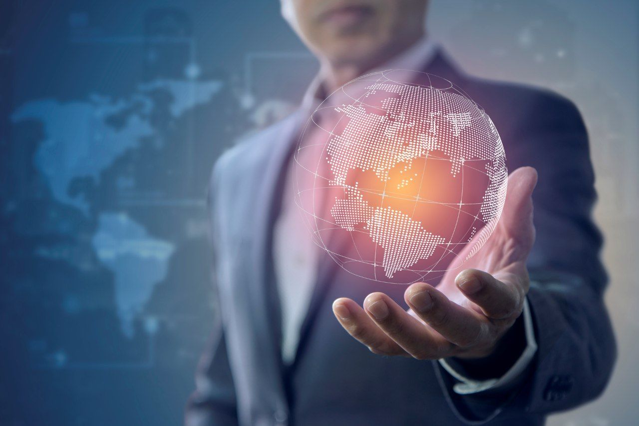 digital globe hovering on a man wearing a suit