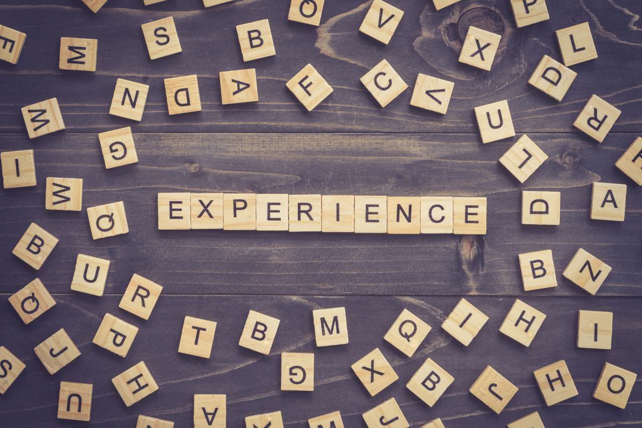 word experience spelled on wooden tiles