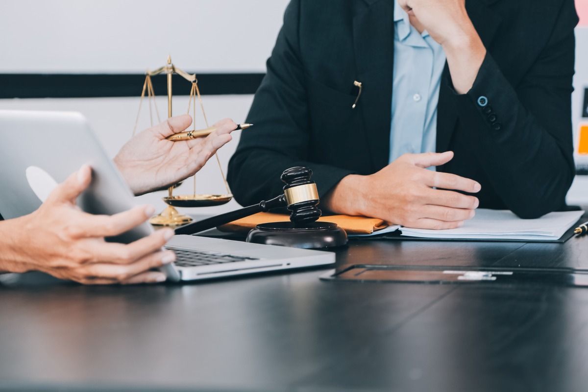 lawyer speaking with a client