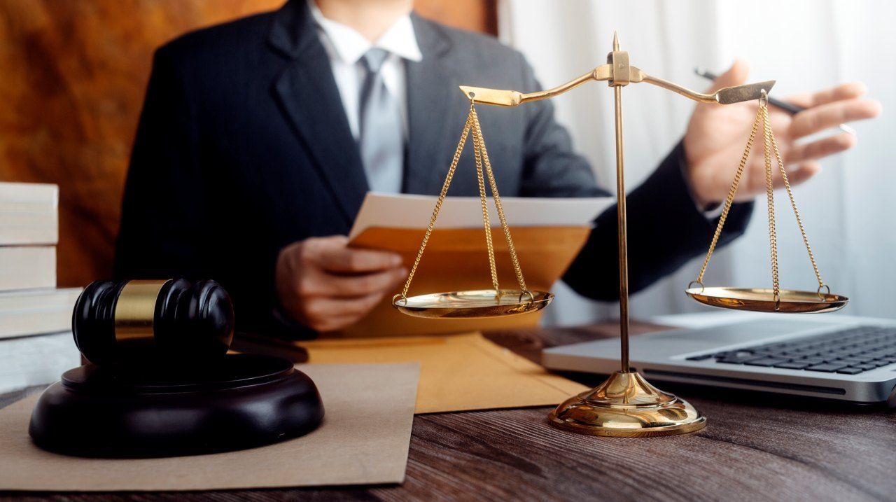 judge in a courtroom with the gavel