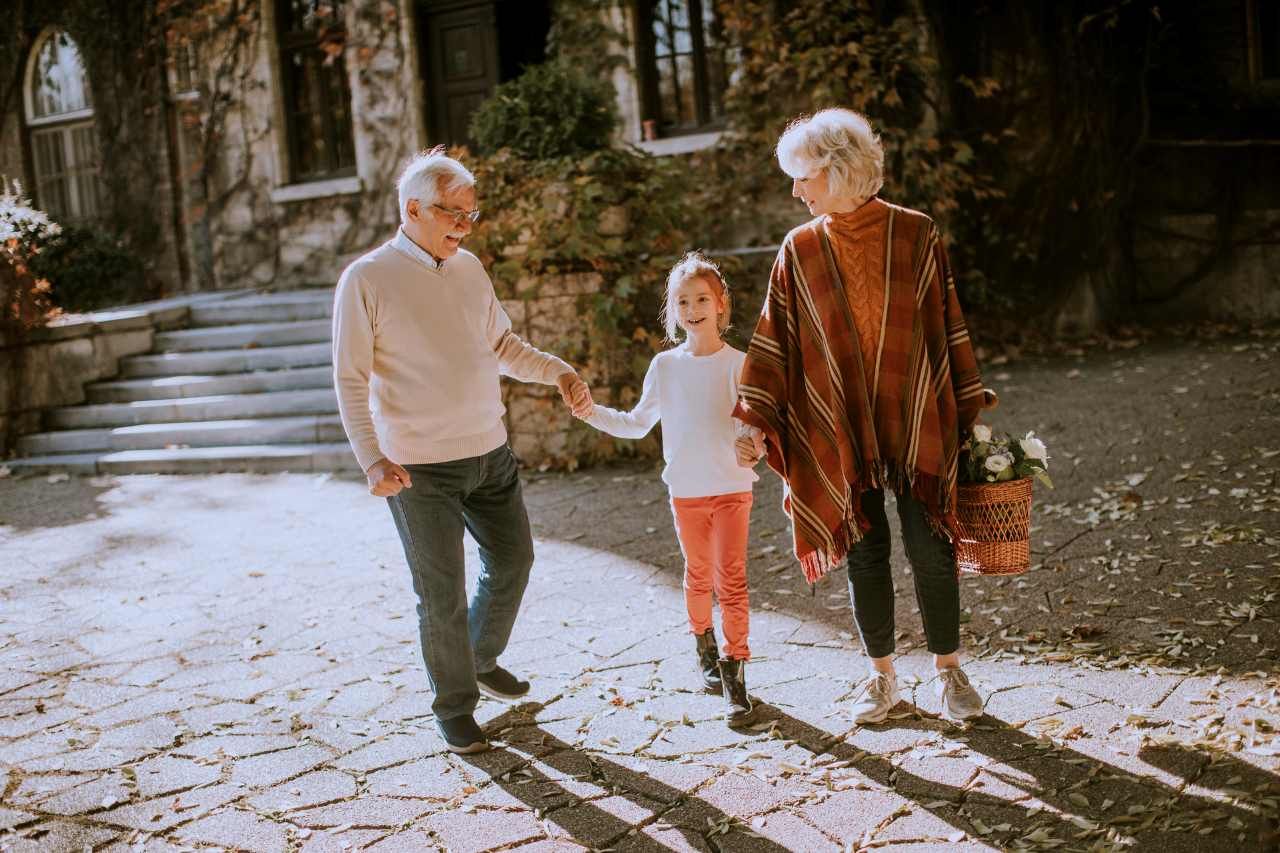 Grandparents enjoying good time with their little granddaughter