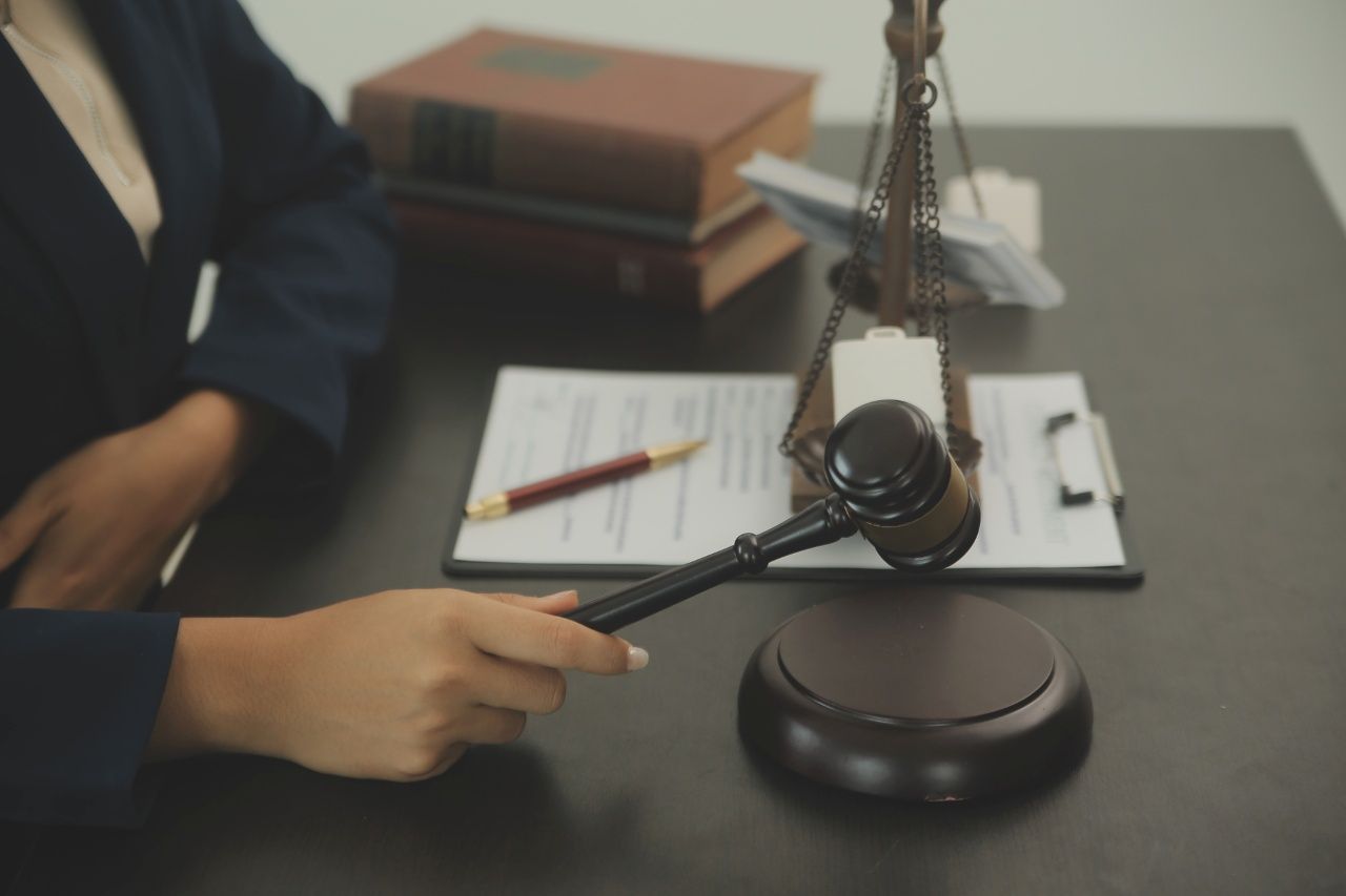 judge in a courtroom with the gavel