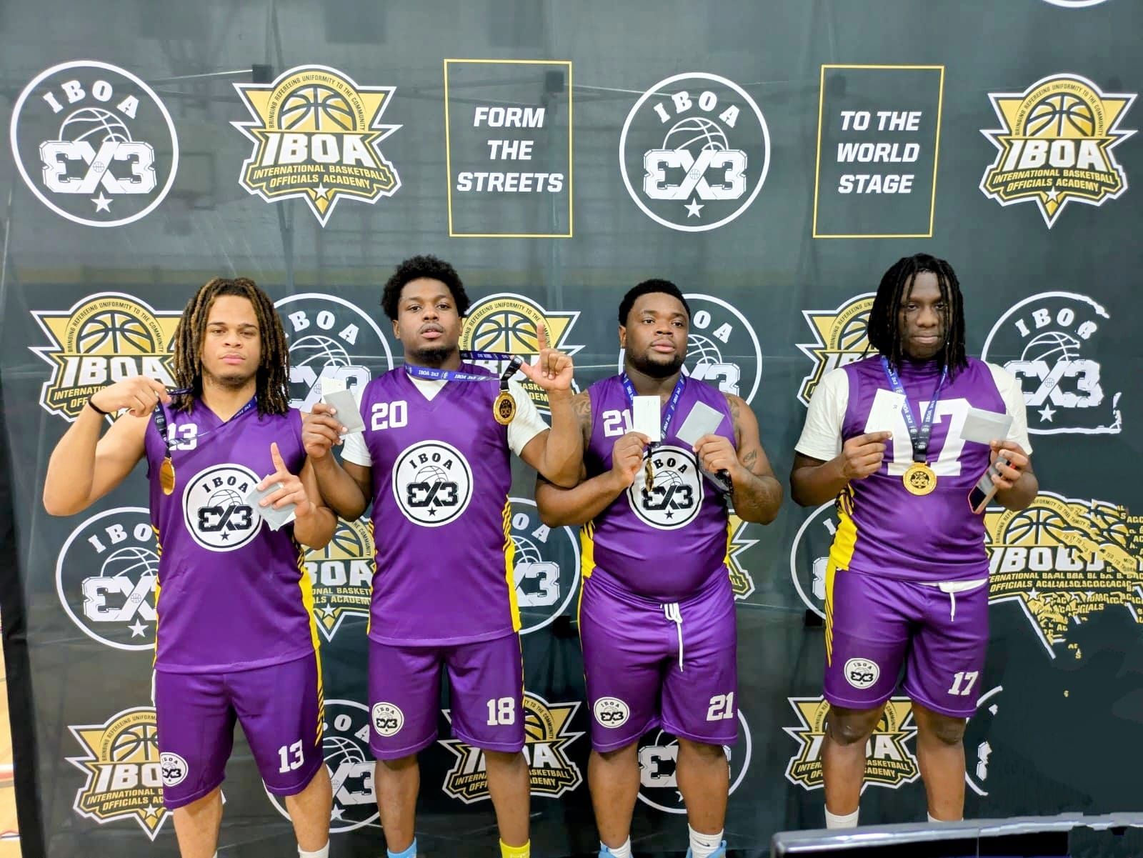 IBOA 3x3 Men's Division team wearing purple uniform posing with their first place gold medals.