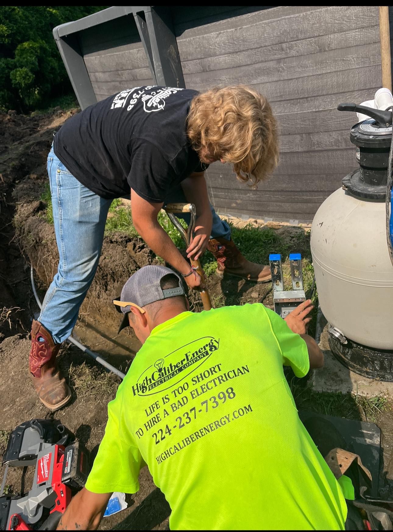 A man and a woman are working on a pool pump.