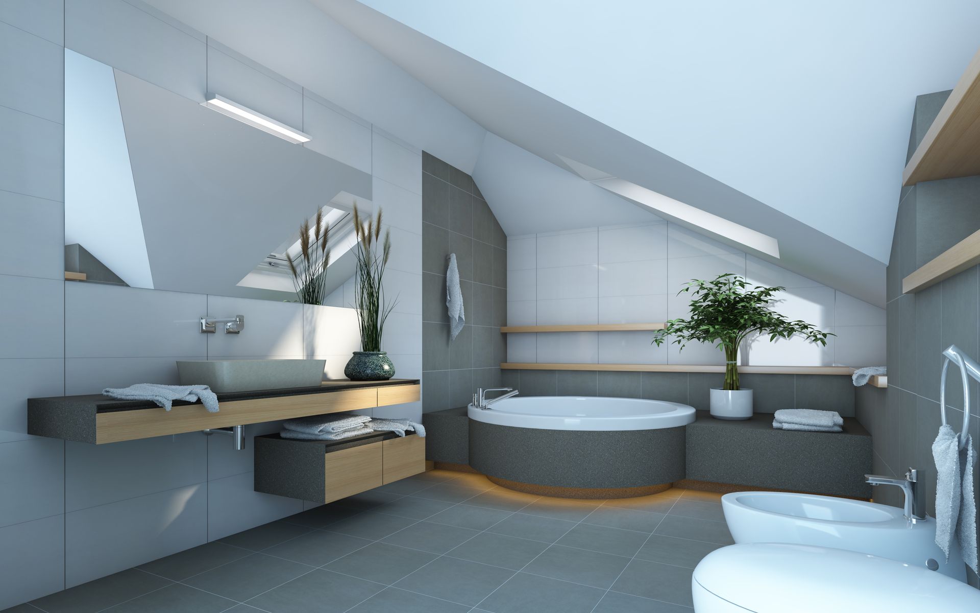 Modern bathroom with gray tile, floating vanity, round tub, and sloped ceiling with skylight.