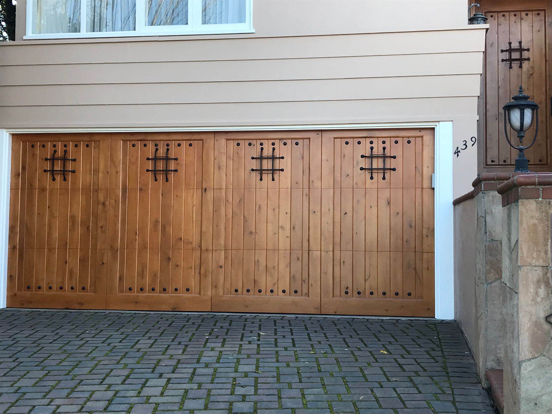A wooden garage door with a hashtag on it