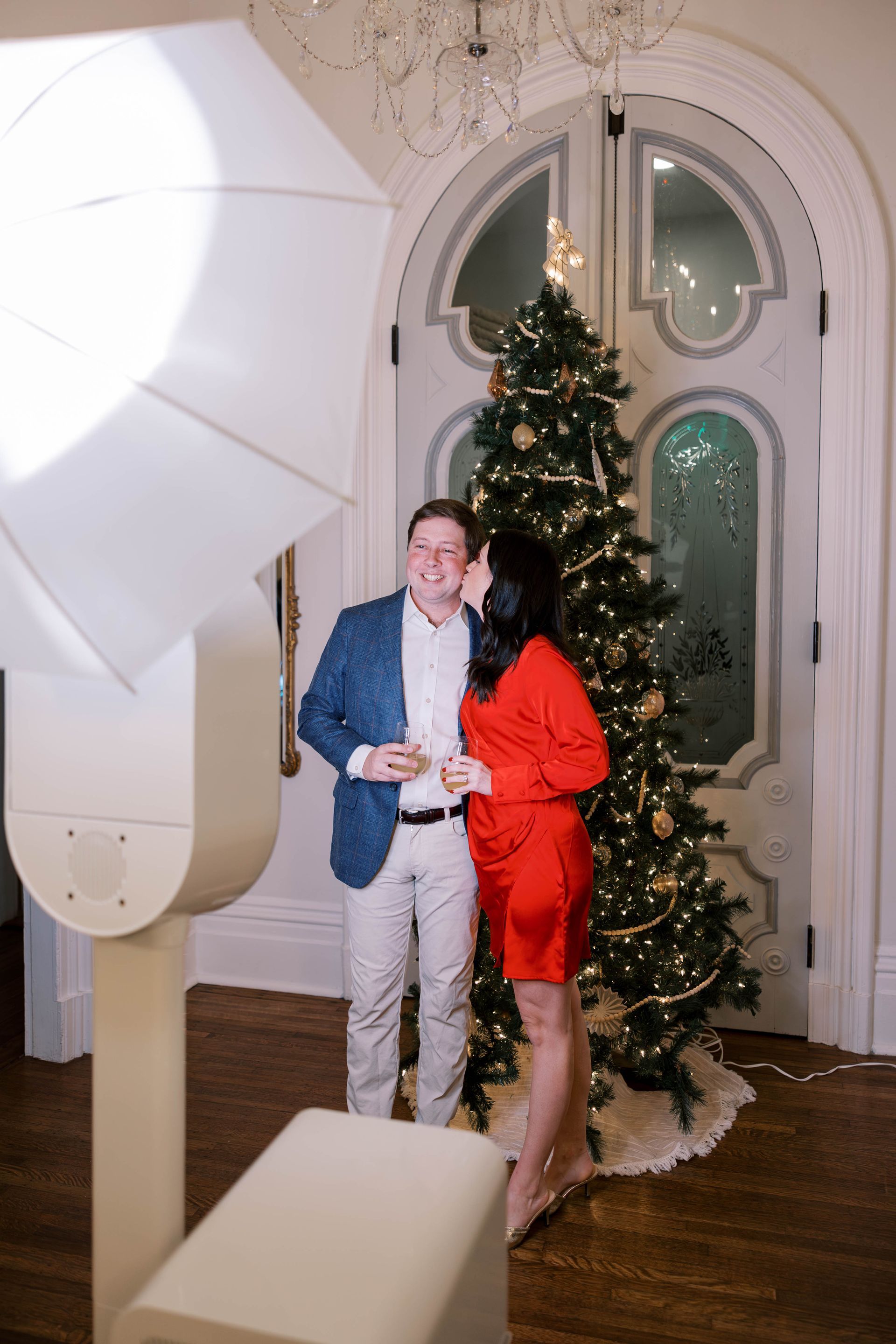 A couple using the Merrimon-Wynne Photo Studio at a Corporate Event Holiday Party at The Merrimon-Wynne House in Raleigh, NC.