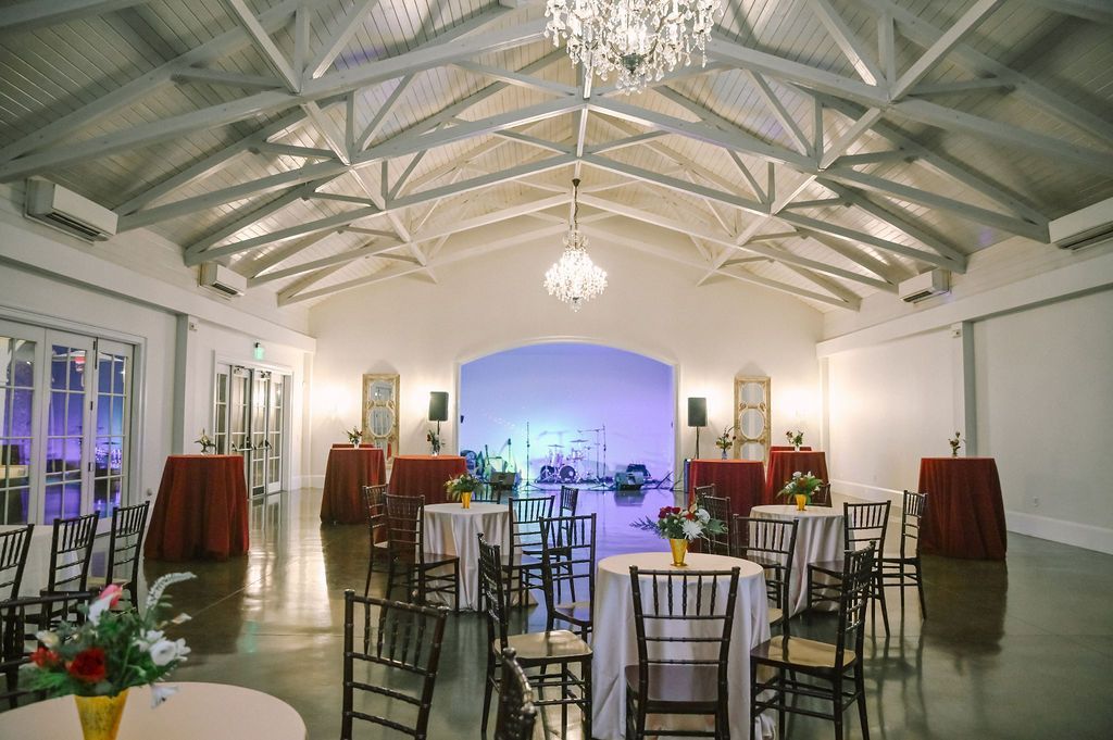 Corporate Event Holiday Party at The Merrimon-Wynne House in Raleigh, NC with long tables and round tables.