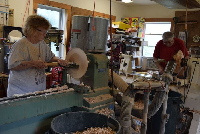 The Sanderson's working on a lathe in their workshop in East Burke, Vermont.