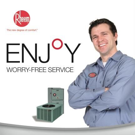 A man stands in front of a sign that says enjoy worry free service